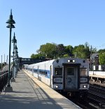 MNR Train # 878, being led by Shoreliner Cab Car # 6310, bypasses Hastings-on-Hudson Station on Track 4